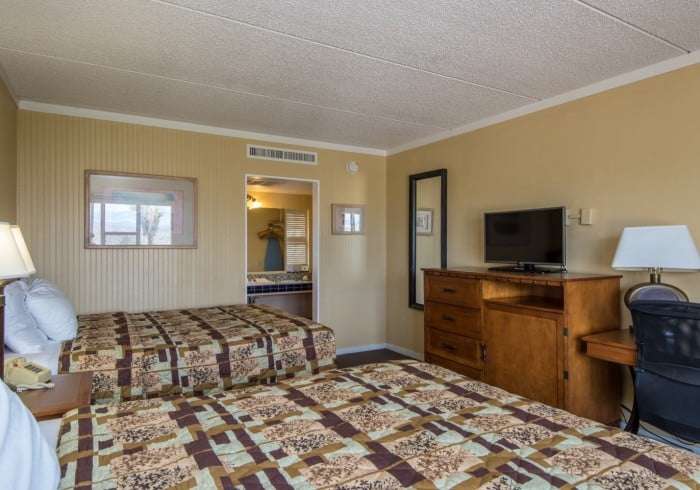 another view of Queen sized bed at landmark lookout lodge